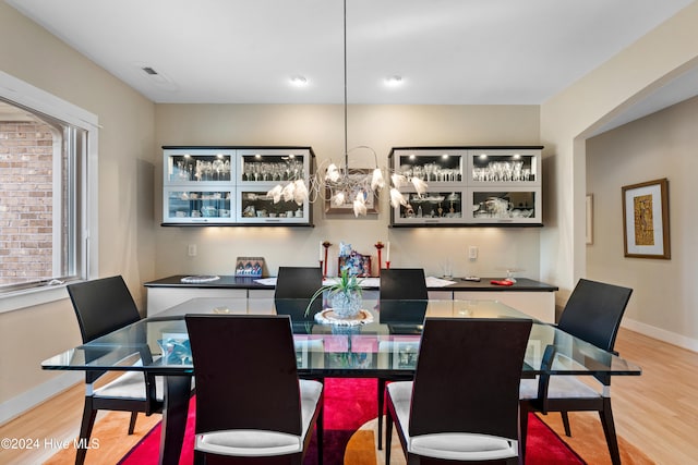 dining space with light hardwood / wood-style flooring