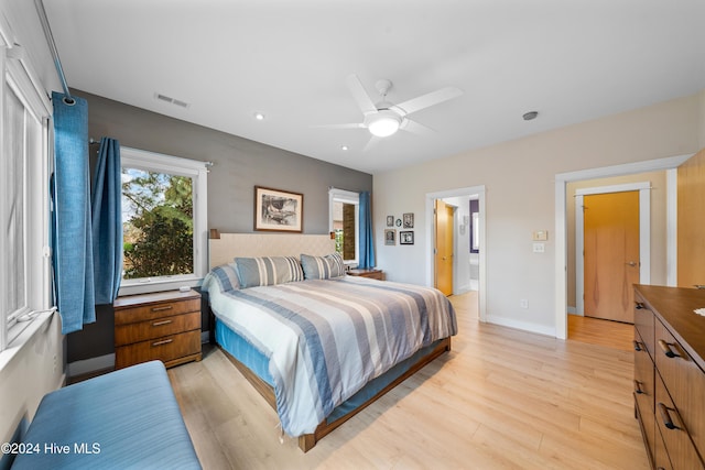 bedroom with recessed lighting, visible vents, light wood-type flooring, baseboards, and ceiling fan