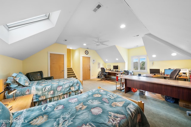 carpeted bedroom featuring ceiling fan and lofted ceiling with skylight