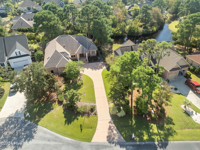 birds eye view of property with a residential view and a water view