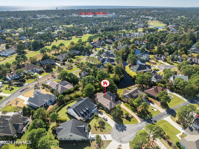 birds eye view of property with a residential view and a water view