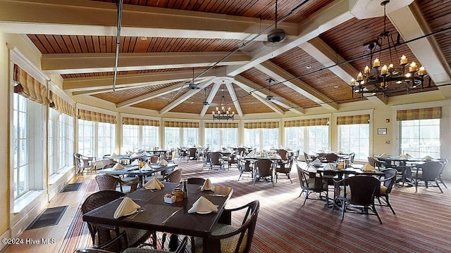 dining room with beam ceiling, a wealth of natural light, wooden ceiling, and a notable chandelier