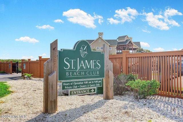 community sign with fence