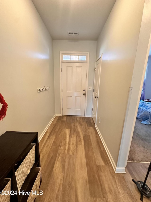 entryway with hardwood / wood-style flooring