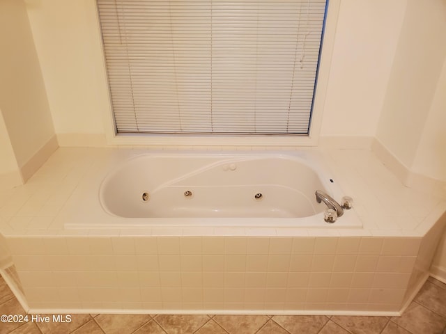 bathroom featuring tile patterned floors and tiled tub