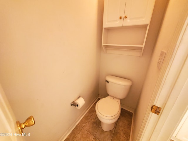 bathroom featuring tile patterned floors and toilet