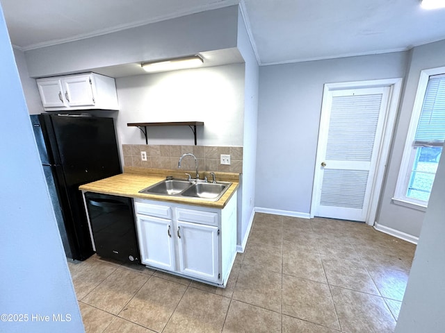 kitchen with white cabinetry, sink, backsplash, and black appliances