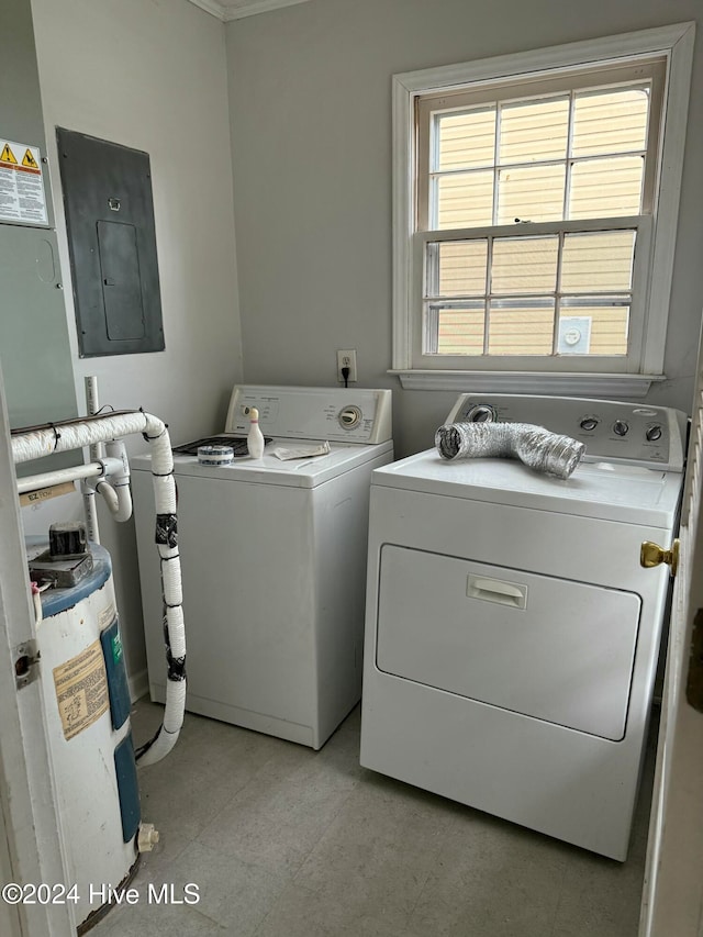 laundry area with electric panel and independent washer and dryer