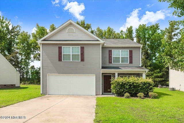 view of front of house with a front lawn and a garage