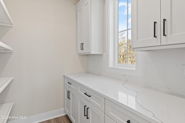 washroom with hardwood / wood-style floors