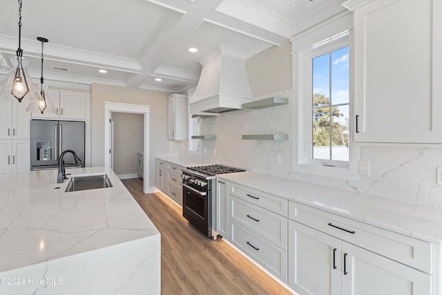 kitchen featuring sink, hanging light fixtures, coffered ceiling, beamed ceiling, and high quality appliances