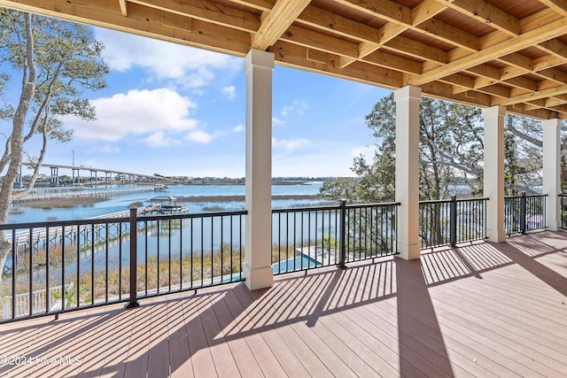 wooden terrace with a water view