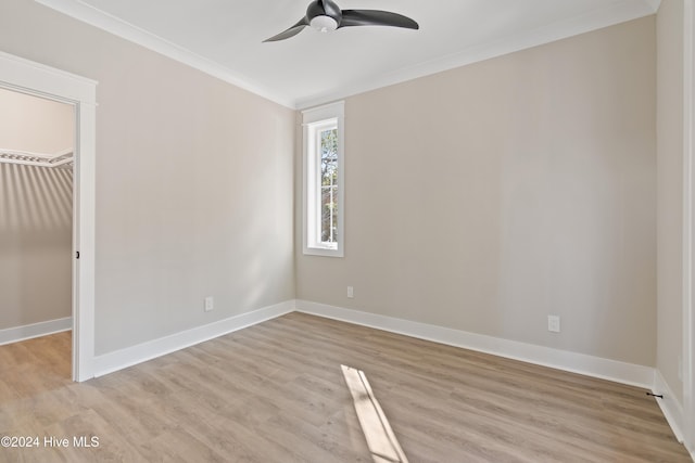 interior space with light hardwood / wood-style floors, ceiling fan, and crown molding