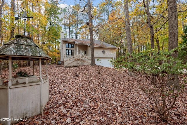 view of front of home featuring a gazebo and a garage