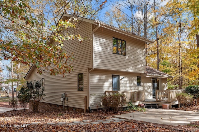 view of front of house with a patio and a deck