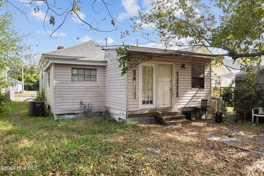 back of property featuring cooling unit