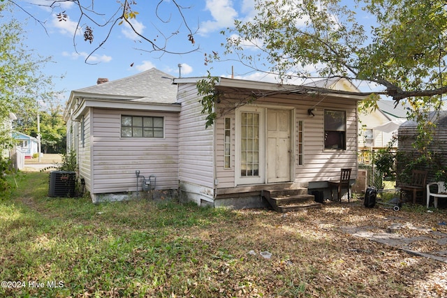 back of property featuring cooling unit