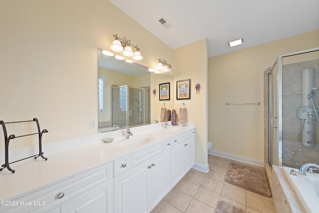 full bathroom with tile patterned floors, vanity, toilet, and independent shower and bath