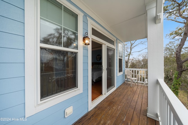 wooden terrace with a porch