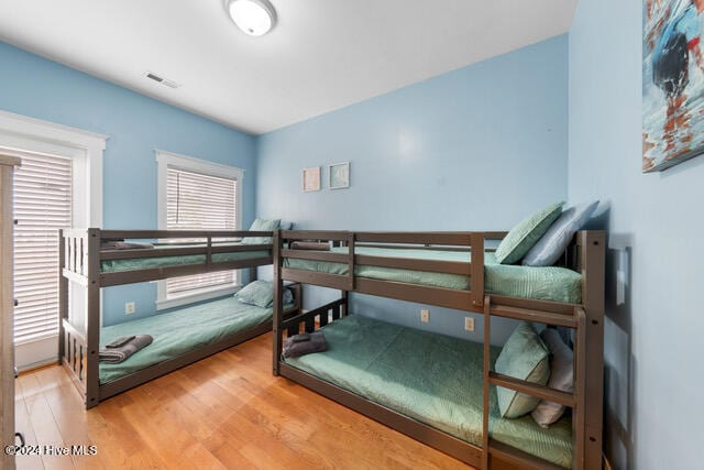 bedroom with hardwood / wood-style flooring