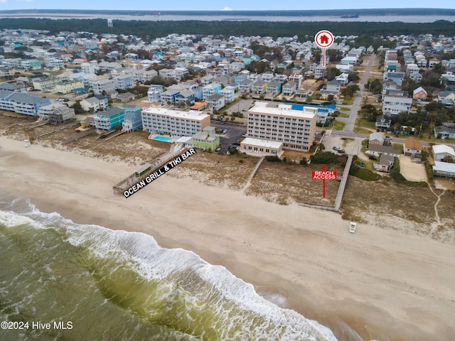 aerial view with a water view and a view of the beach