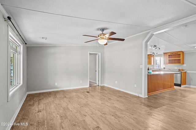 unfurnished living room with ceiling fan, ornamental molding, a textured ceiling, and hardwood / wood-style flooring