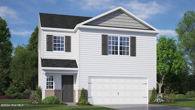 view of front facade with a front yard and a garage