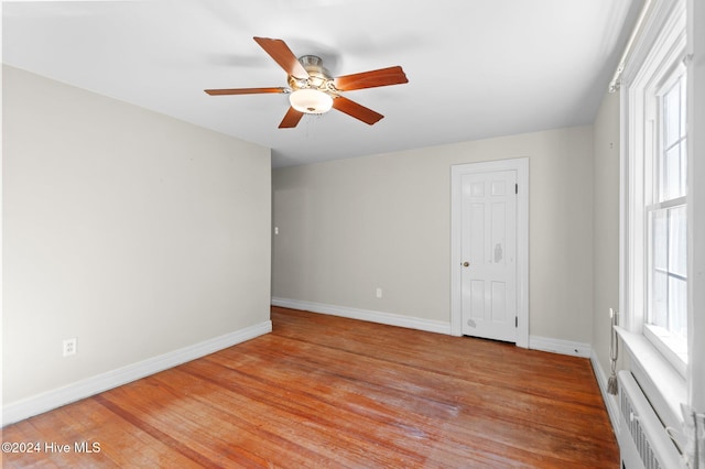 unfurnished room featuring ceiling fan and light wood-type flooring