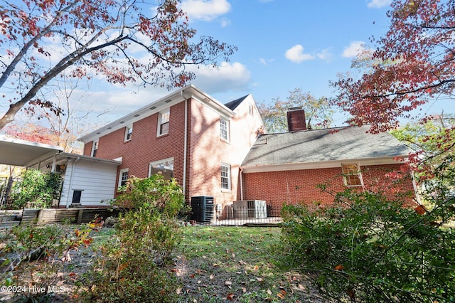 back of house featuring central AC