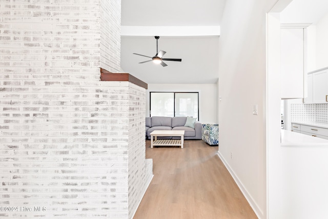 hallway with light hardwood / wood-style floors