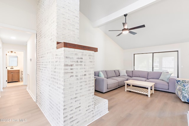 living room featuring beamed ceiling, light wood-type flooring, high vaulted ceiling, and ceiling fan