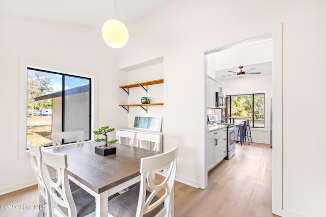 dining space featuring ceiling fan and light hardwood / wood-style floors