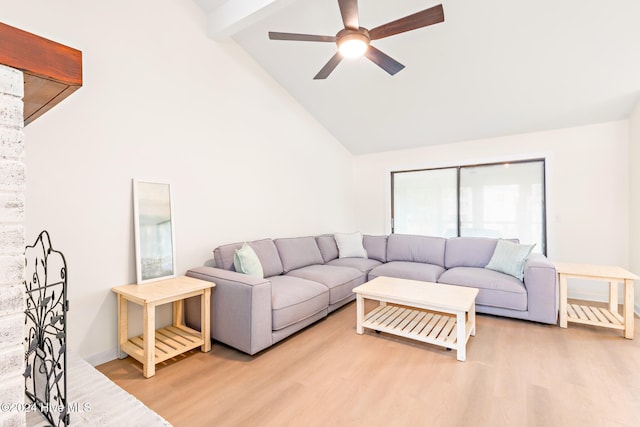 living room with beam ceiling, light hardwood / wood-style flooring, and high vaulted ceiling