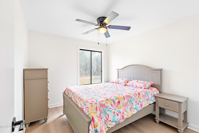 bedroom with ceiling fan and light wood-type flooring