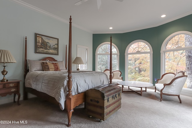 bedroom featuring ceiling fan, ornamental molding, and light carpet