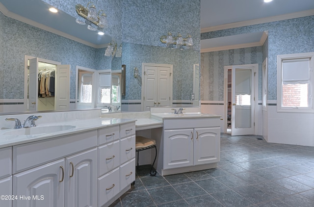 bathroom with vanity, crown molding, and a wealth of natural light