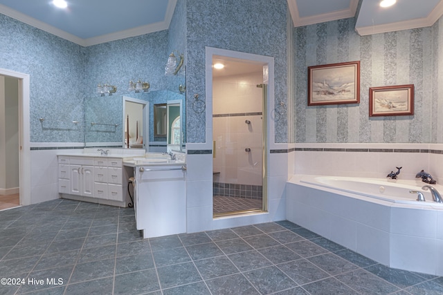 bathroom with tile patterned floors, vanity, crown molding, and plus walk in shower