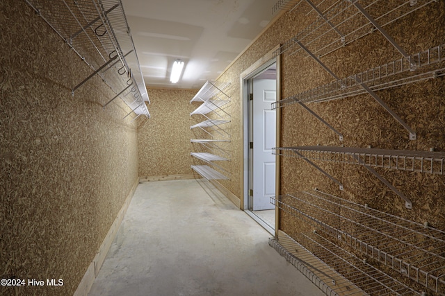 hallway with concrete flooring