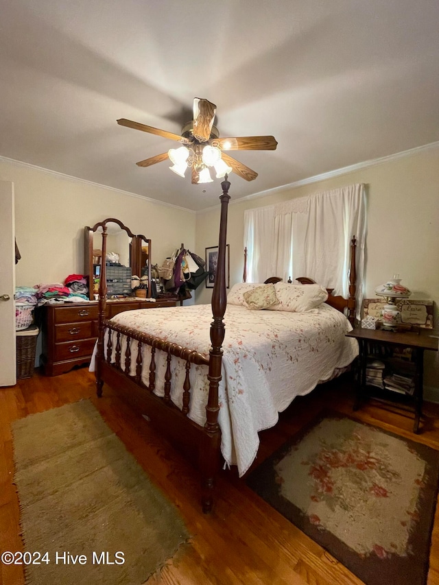 bedroom featuring ceiling fan and dark wood-type flooring