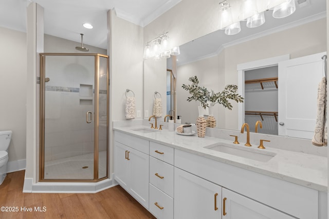 1514 Mackerel Ln, Carolina Beach, NC 28428 - full bathroom featuring toilet, wood finished floors, a sink, and a stall shower