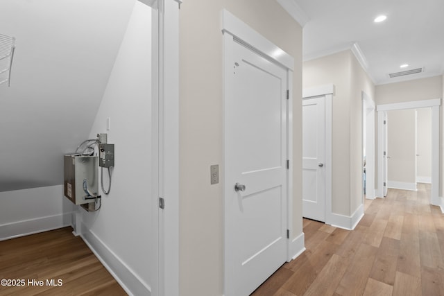 1514 Mackerel Ln, Carolina Beach, NC 28428 - hallway with light wood-style flooring, visible vents, recessed lighting, and crown molding