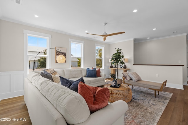1514 Mackerel Ln, Carolina Beach, NC 28428 - living room featuring recessed lighting, a wainscoted wall, wood finished floors, a ceiling fan, and ornamental molding