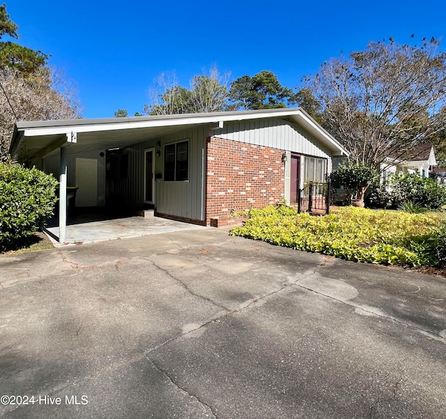 exterior space featuring a carport