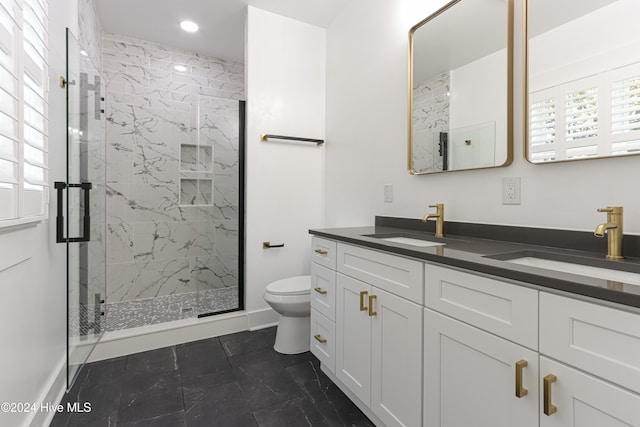 bathroom featuring vanity, toilet, and walk in shower