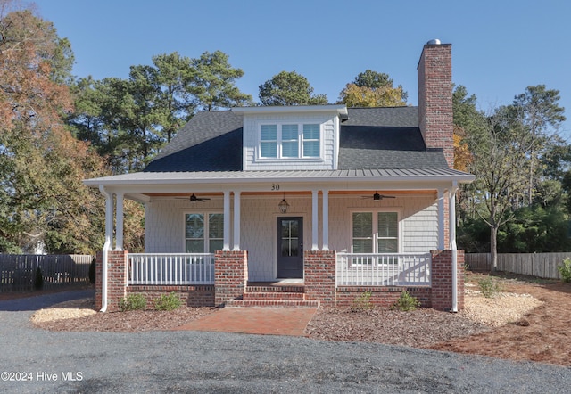 view of front of property featuring ceiling fan and covered porch