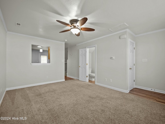 unfurnished room with crown molding, carpet, and ceiling fan