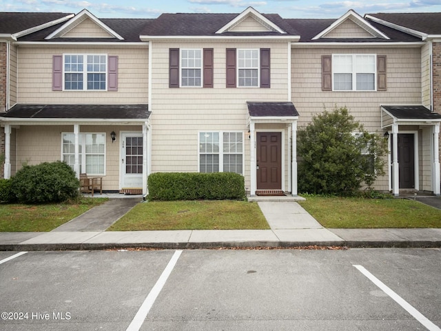 view of property with a front lawn