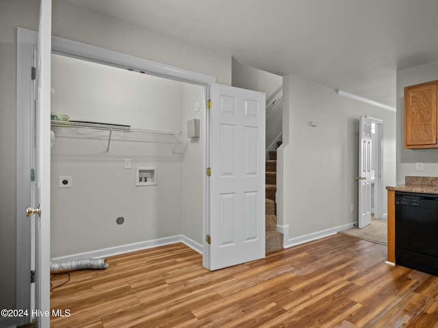 clothes washing area featuring electric dryer hookup, light wood-type flooring, and hookup for a washing machine