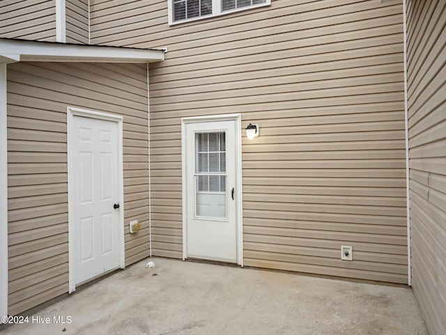 property entrance with a patio