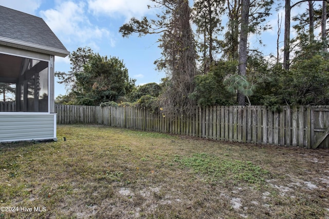 view of yard with a sunroom